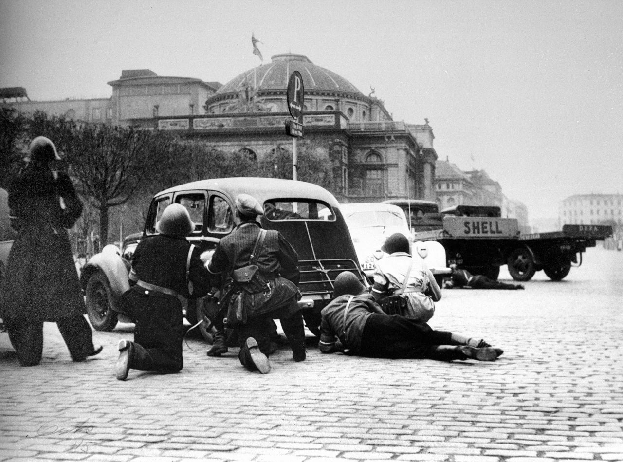 Ib Jelsdal and his group, seeking cover behind a car on Kongens Nytorv Copenhagen Denmark WWII 1945